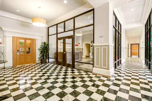 A hallway with a black and white checkered floor.