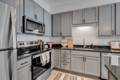 the isaac apartments roseville minnesota kitchen with stainless steel appliances