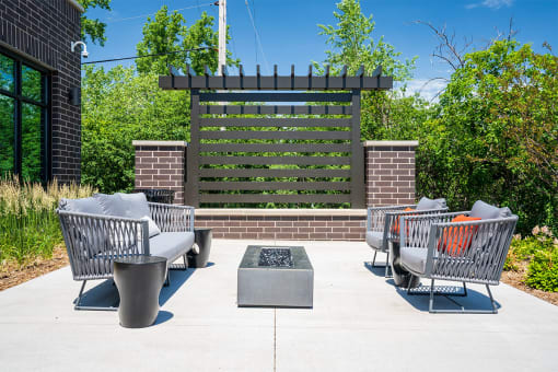 the isaac apartments roseville minnesota outdoor fire pit and seating