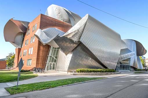 A modern building with a unique design is shown.
