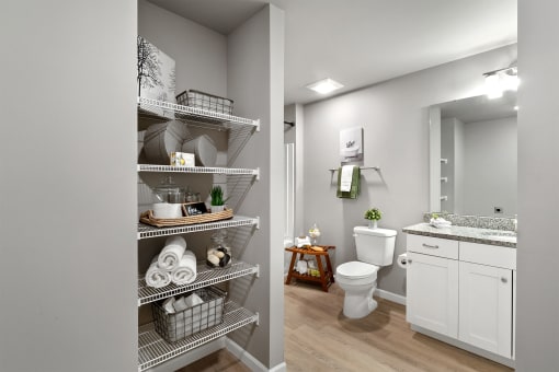 a bathroom with a shower and a toilet and a sink