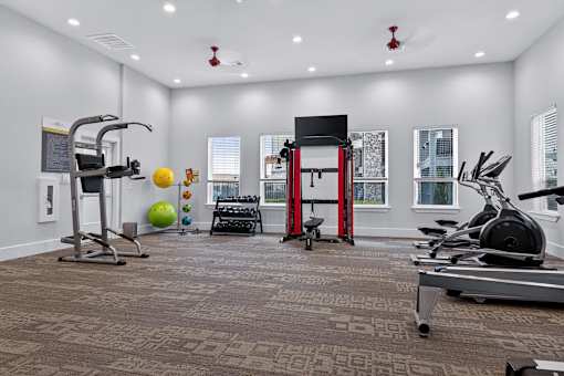 A home gym with a variety of exercise equipment.