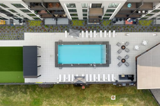 a birds eye view of the pool area of the hotel