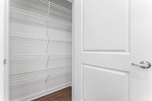 A white door with a white interior and a white handle.