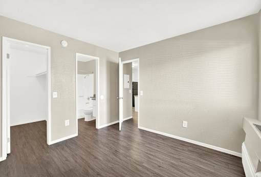 A room with three mirrors on the wall.
