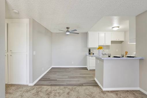Open concept kitchen with breakfast bar at ELEVATE Apartments HOMES, Placentia, CA 92870