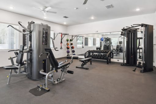the gym is equipped with weights and cardio equipment at Gibson Oaks, Lakeland, 33809