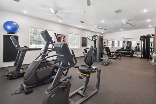 the gym is equipped with cardio equipment and weights at Gibson Oaks, Lakeland, 33809
