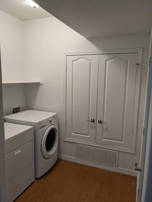 A laundry room with a washer and dryer.