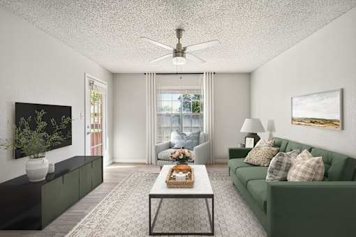 A living room with a green couch and a coffee table.