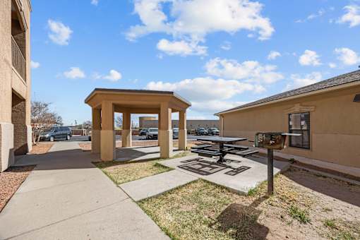 A sunny day at the outdoor seating area of a building.