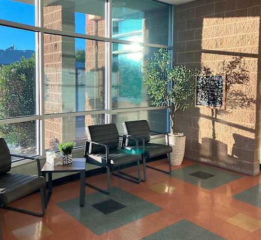 A sunny day at the office with a view of the sky through the windows.