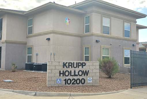 A building with a sign that says "Krupp Hollow 10200".