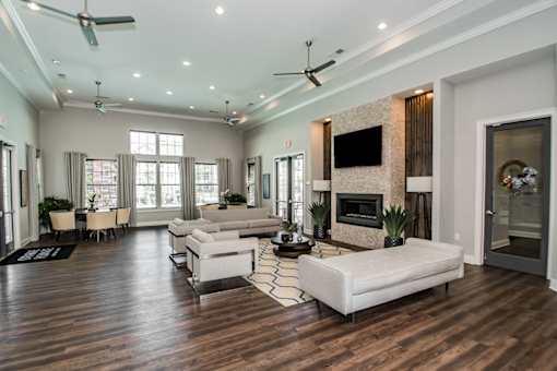 A spacious living room with a fireplace and a television.