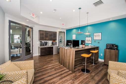 A room with a blue wall and a wooden floor.