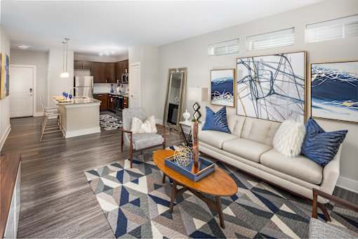 A living room with a white couch and a coffee table.