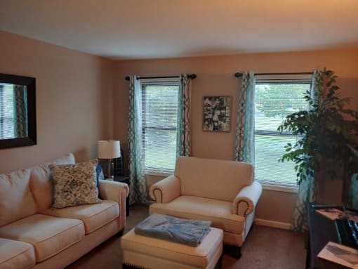 a living room with a couch and two chairs