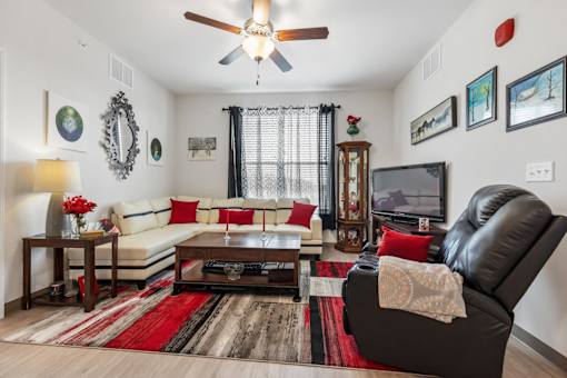 a living room with a couch and a tv