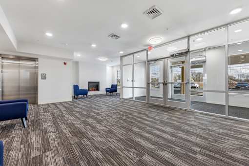 the preserve at ballantyne commons community room with chairs and a fireplace