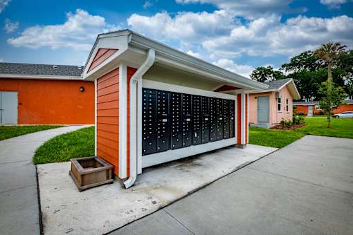 A small orange house with a black window.