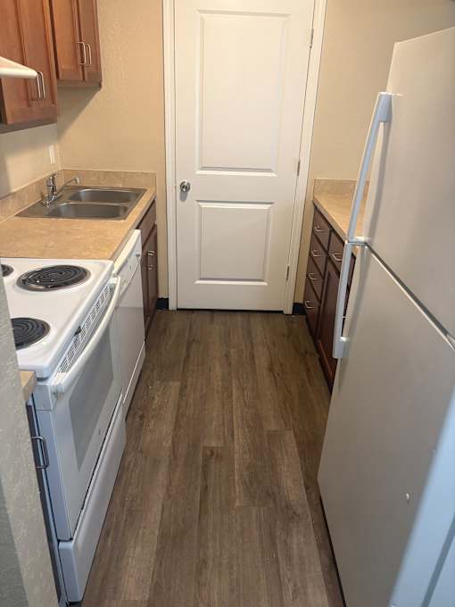 A white microwave oven is placed on a countertop.