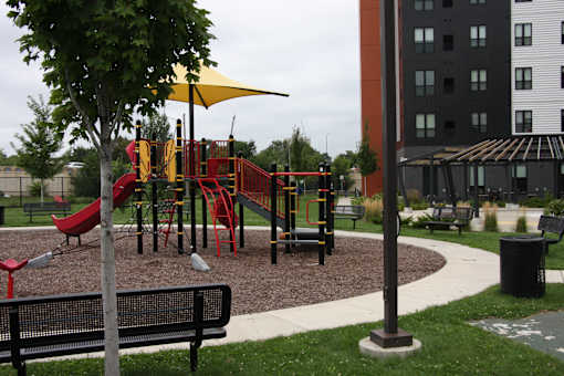 a playground in a park next to a building