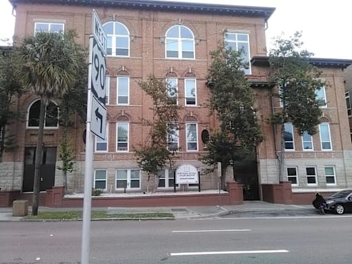 A brick building with a sign that says "1951" on it.
