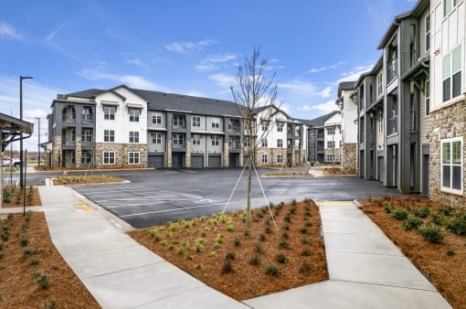 new apartments and large parking lot at Tapestry Overbrook in McDonough, Georgia