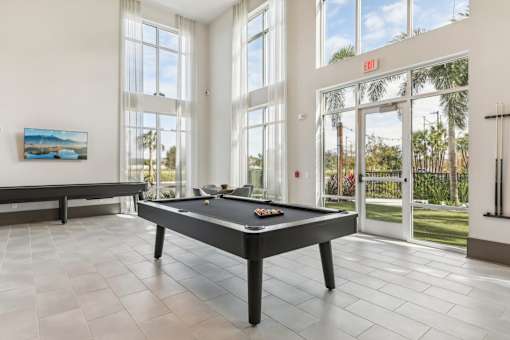 the pool table in the clubhouse at Tapestry Headwaters Apartments in Kissimmee, FL