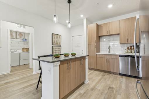 Island Kitchen with Pendant Lighting at Tapestry Headwaters in Kissimmee, FL