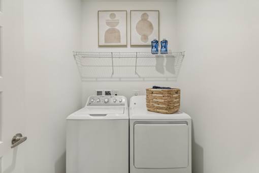 laundry room with full-size washer and dryer at Tapestry Headwaters in Kissimmee, FL