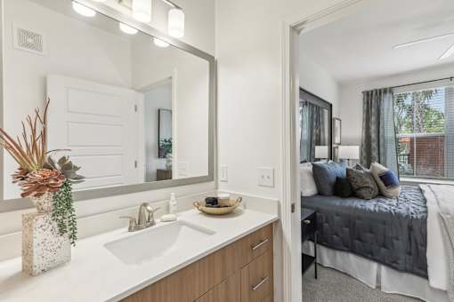 a bedroom with en-suite bathroom at Tapestry Headwaters Apartments in Kissimmee, FL