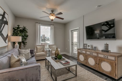Living room with patio access at Flats on 4th Apartments in Birmingham, AL