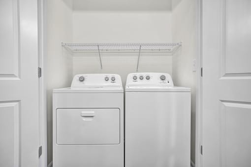 Washer and Dryer included in laundry room.