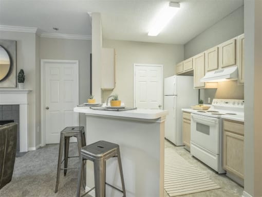a kitchen with a counter top and stools