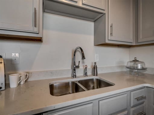 Stainless Steel Sink With Faucet In Kitchen at The Tower Apartments, Alabama