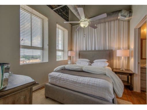 Bedroom With Expansive Windows at The Tower Apartments, Tuscaloosa, AL, 35401