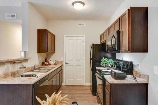 Black Appliances in Kitchen at Austin Place Apartments