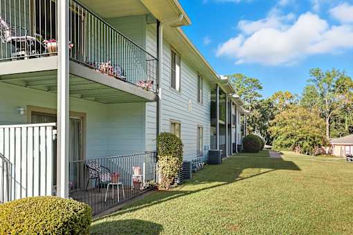 A sunny day at a row of houses with balconies.