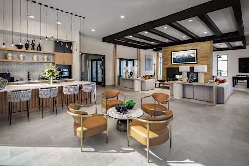 A modern living room with a bar area and a television.