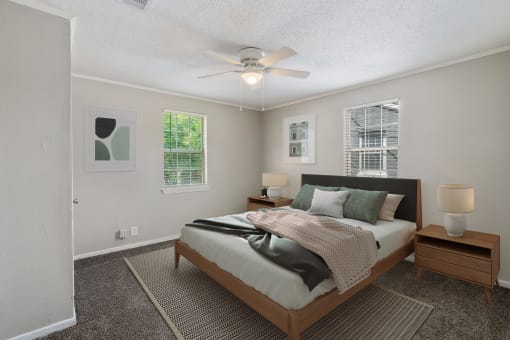 light and bright bedroom with natural light  Living Room with wood flooring at Midtown Oaks Townhomes in Mobile, AL