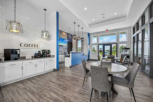 A coffee shop with a counter and chairs.