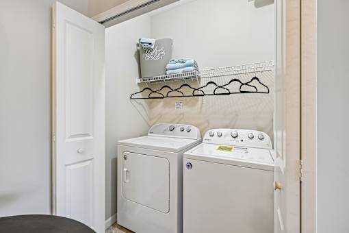 A laundry room with a washer and dryer.