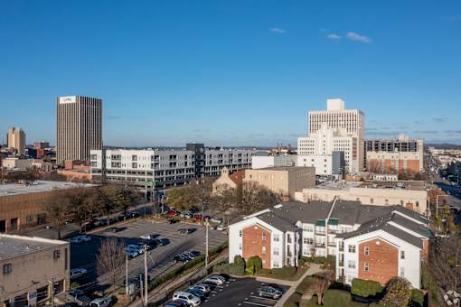 A cityscape with buildings and cars.