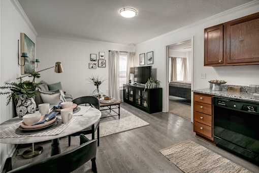 A modern kitchen and dining area with a table set for a meal.