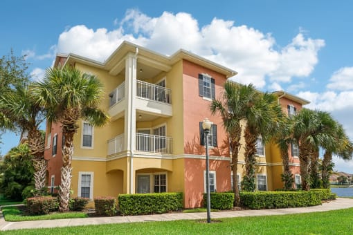 a building with palm trees in front of it