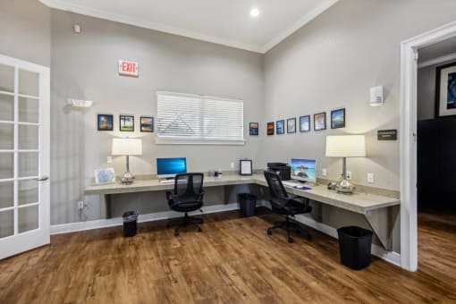 a home office with two desks and two computers