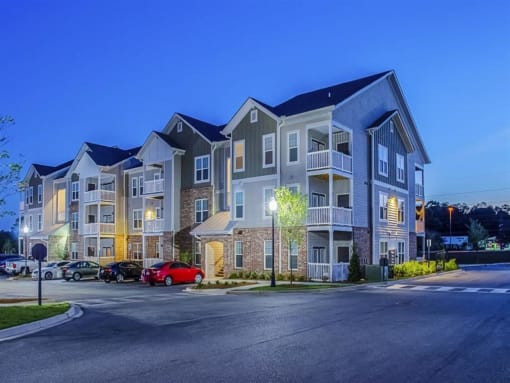 a large apartment building with a street in front of it