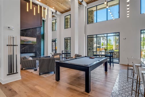 resident social lounge with pool table at Tapestry Overbrook in McDonough, Georgia
