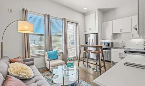 Open concept living room and kitchen at Avion at West Lemmon Apartments, Dallas, 75235